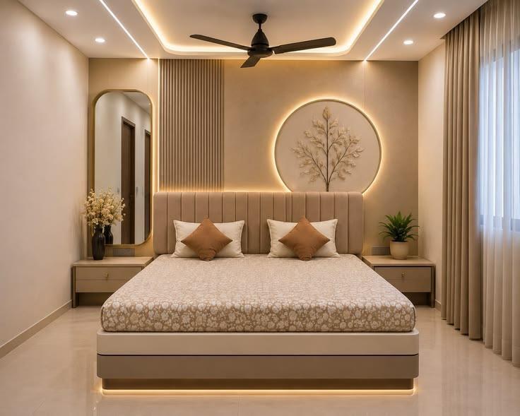 Contemporary master bedroom with circular relief art, arch mirror, and warm cove lighting in Bhopal